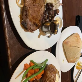 Medium well prime rib and top sirloin w/ veggies, garlic mash and potato only butter.
