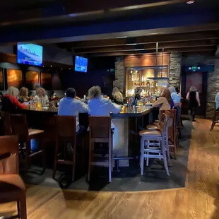 people sitting at the bar