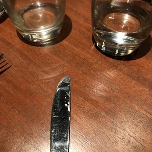 Dirty silverware dirty carafe dirty water glass