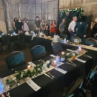 Our table set ups and people in line to eat from buffet