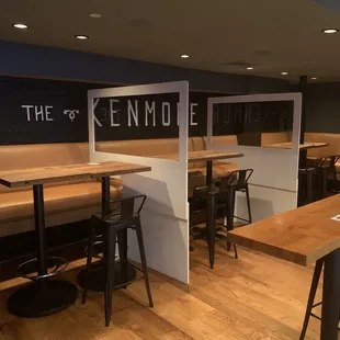 an empty restaurant with tables and stools