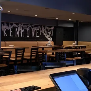 an empty restaurant with tables and chairs