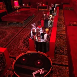 a living room with red couches