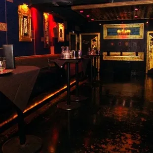 a dimly lit room with a bar