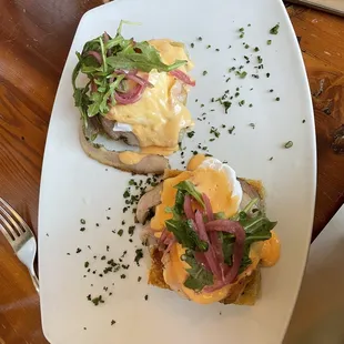 Focaccia Eggs Benedict with porchetta, arugula, and Calabrian chili hollandaise. So good!