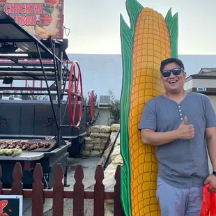 Corn next to a big grill station.