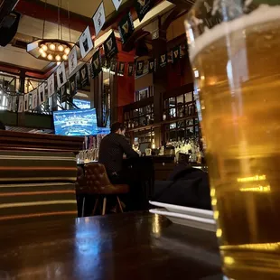 a pint of beer in a bar