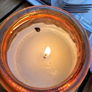 Candle light on tables outside when it gets dark