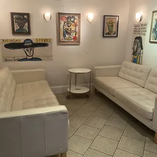 a living room with white couches