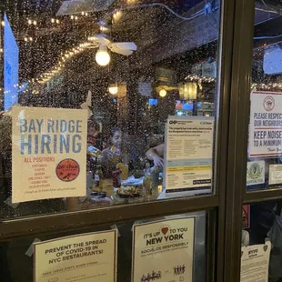 a sign in the window of a restaurant