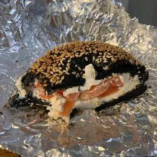 a bagel sandwich on tin foil