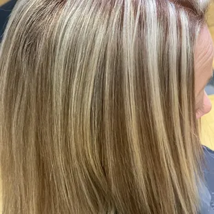 Chunky highlights with a color gloss for shine. Beautiful blunt haircut .