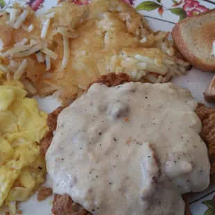 Country Fried Steak and Eggs with Hash browns.