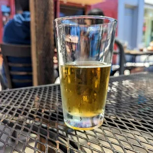 a glass of beer on a table
