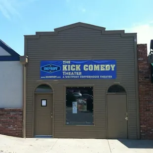 The Kick Comedy Theater is located between The Westport Coffee House &amp; Green Room Burgers &amp; Beer.