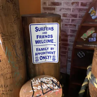 surfboards and a welcome sign