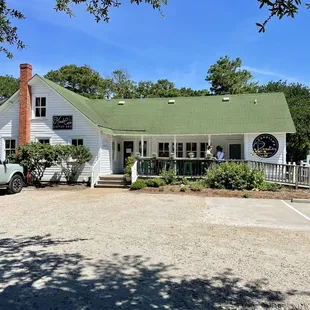Front entrance / exterior of the shop with plenty of onsite parking available. Front porch has seating to sit and sip.