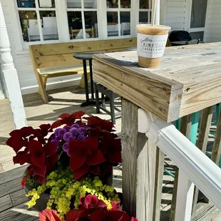 a cup of coffee on a porch