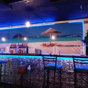 a bar with blue lighting