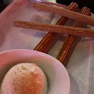 Churros and vanilla ice cream topped with cinnamon sugar
