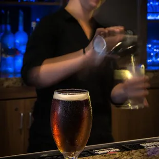 Bartender and Backlit bar area