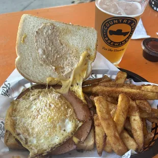 Bologna sandwich with an egg and grape fries too