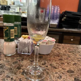 a glass of wine on a counter