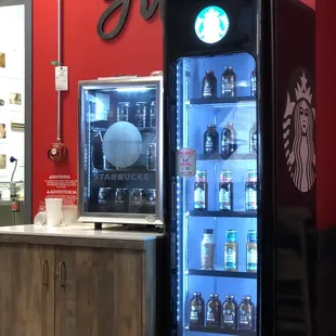 a starbucks vending machine in a coffee shop