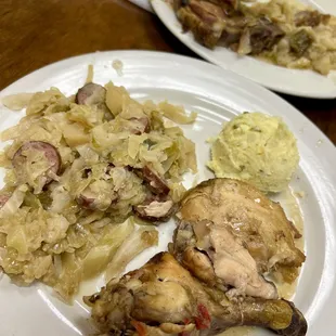 Chicken with smothered Cabbage &amp; Potato Salad (cornbread not shown). Smothered Pork-chop in rear.