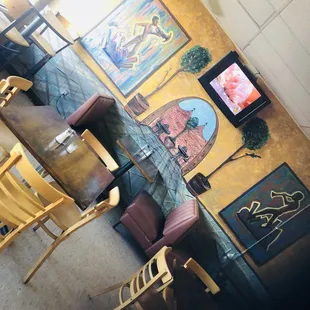 a table and chairs in front of a television