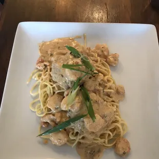 Crab Cakes over pasta w/ seafood sauce