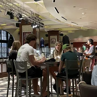 a group of people sitting at a table