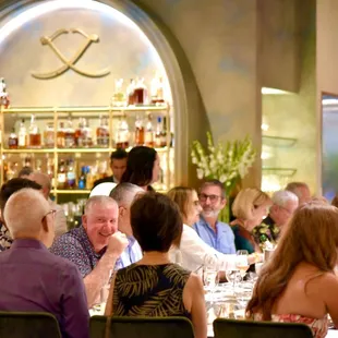 The executive chef and staff present the meal in a lively, theatrical demonstration format.