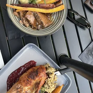 Pork shoulder and half duck with roasted carrots