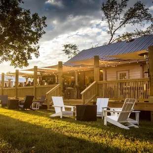 Outdoor patio tables under the trees is the perfect place to watch the sunset