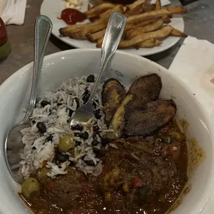 Ropa Vieja special with beans rice and tostones. Black bean burger