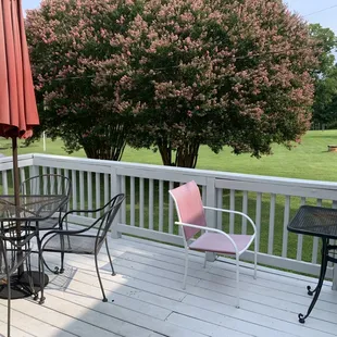 a patio with a table and chairs