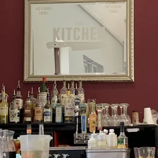 a bar with bottles of alcohol