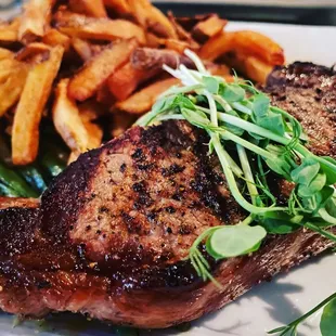 NY strip with bearnaise sauce (underneath) fries and green beans.