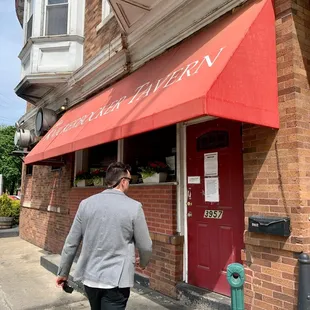 a man walking down the sidewalk