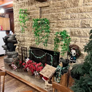 a living room with a stone fireplace