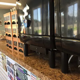a kitchen counter with a refrigerator