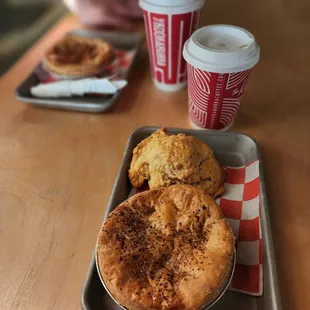 a tray of food and a cup of coffee