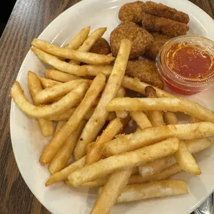 a plate of french fries and ketchup