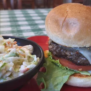 a hamburger and coleslaw