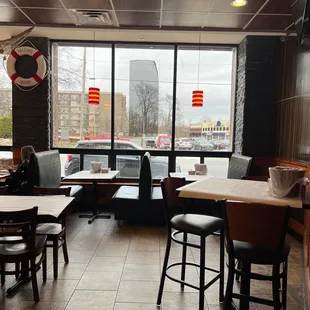 a restaurant with tables and chairs