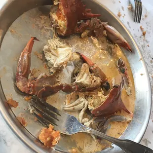 a half eaten crab on a plate