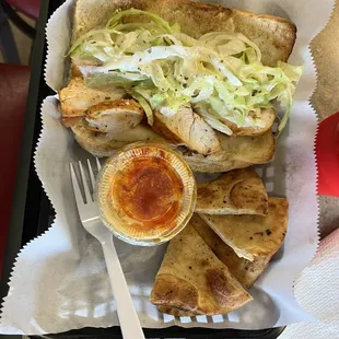 Grilled chicken hot sub with a side of hummus