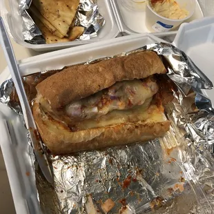 This is HALF of the large homemade meatball sandwich with a side of humus and pita. It was all incredible and the meatballs tasted great!