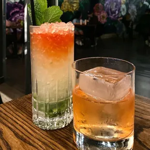 two cocktails on a wooden table